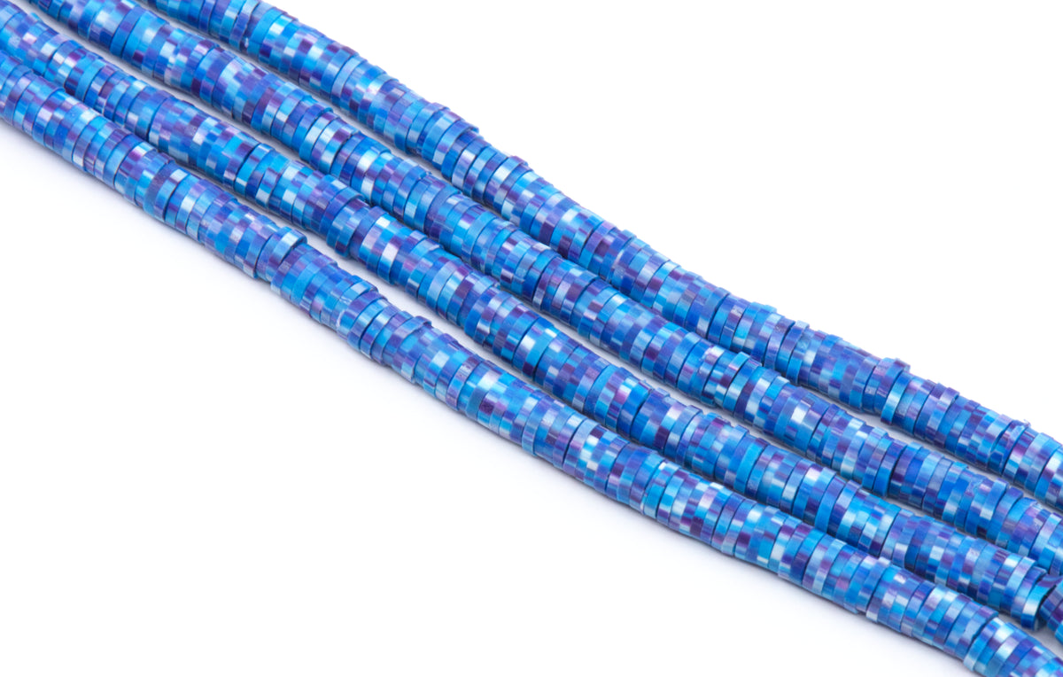 Four strands of polymer clay beads with a blue and purple pixelated mosaic pattern, photographed on a clean white background.
