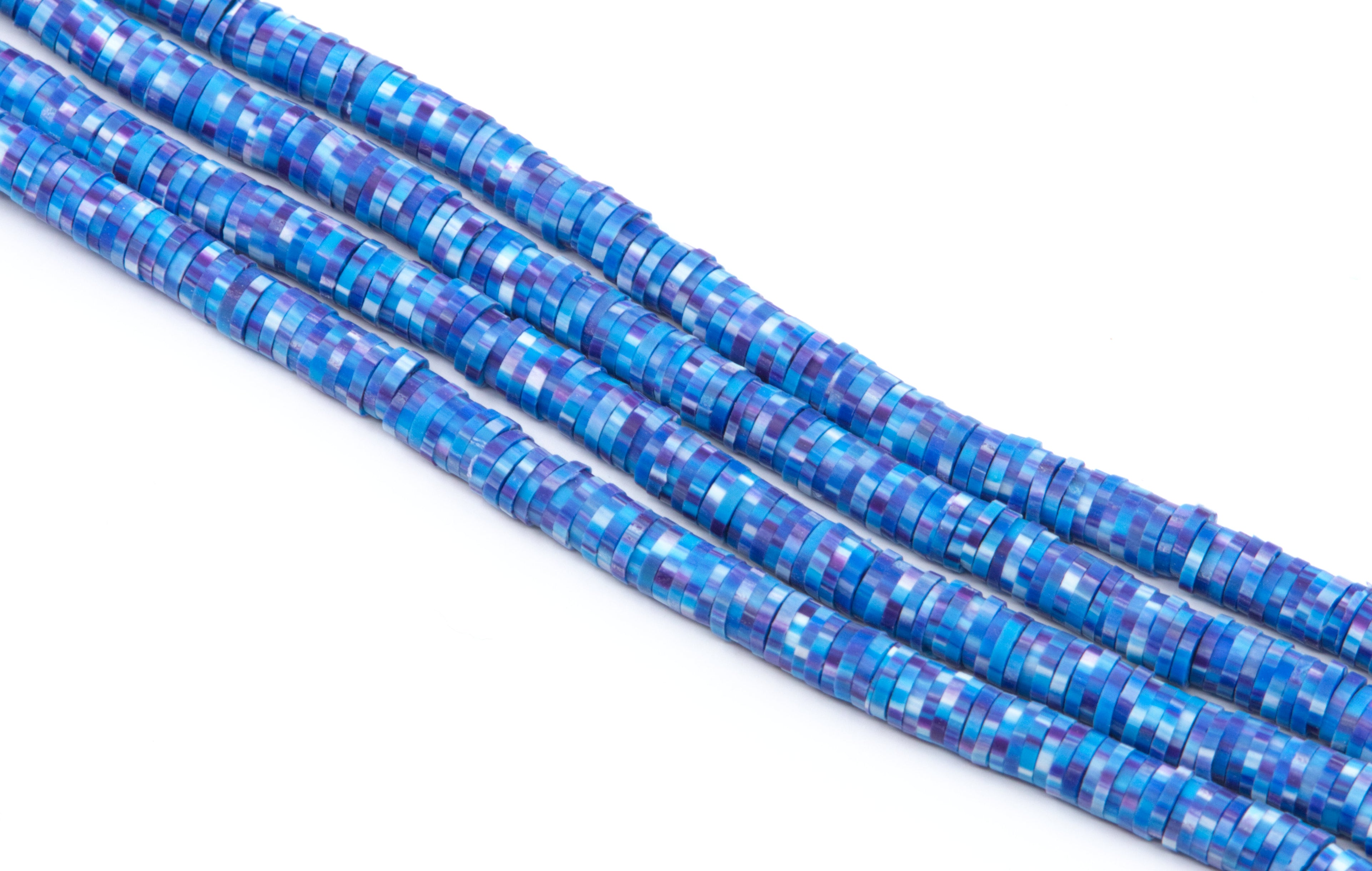 Four strands of polymer clay beads with a blue and purple pixelated mosaic pattern, photographed on a clean white background.