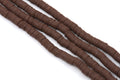 Four strands of dark brown polymer clay disc beads arranged diagonally on a plain white background.