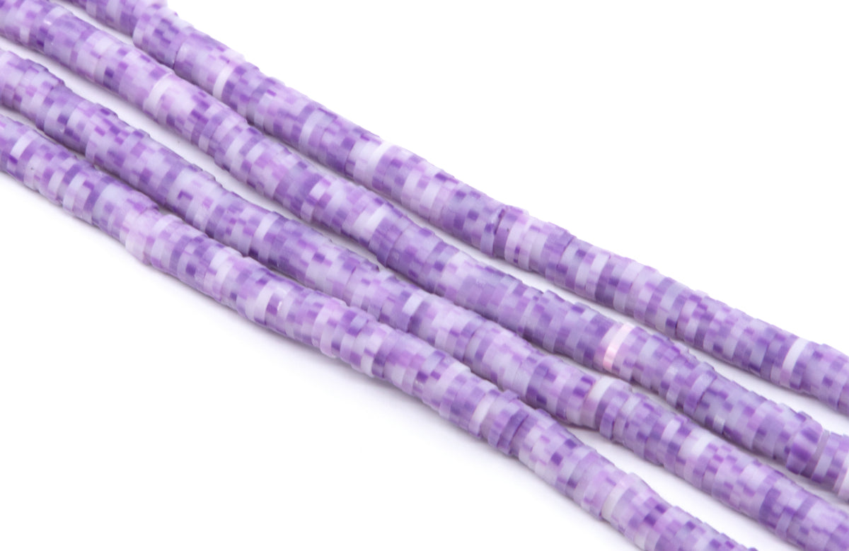 Purple and white polymer clay beads arranged in diagonal strands on a plain white background.