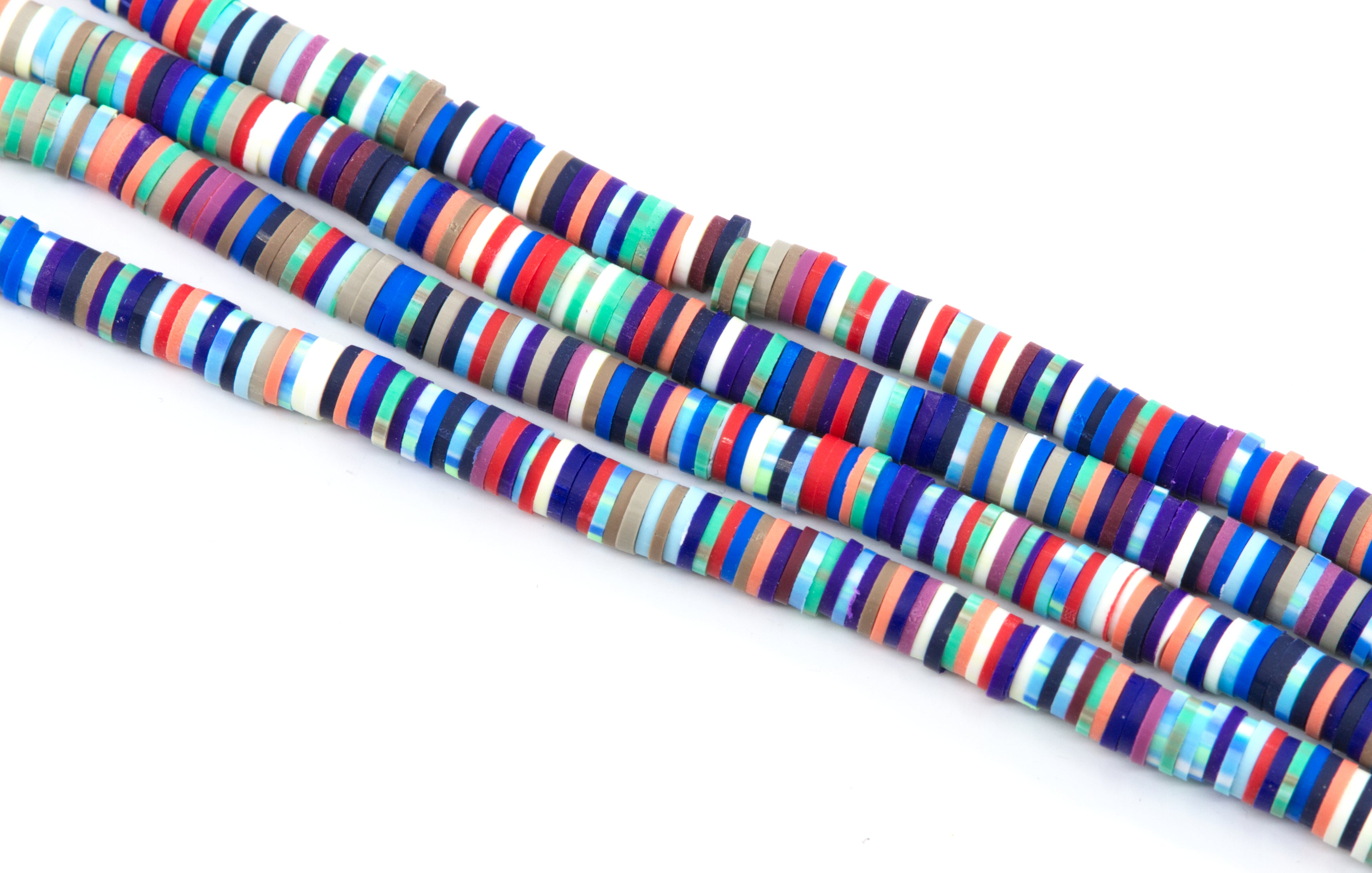 Several strands of red and blue multi-color polymer clay disc beads arranged diagonally on a plain white background.