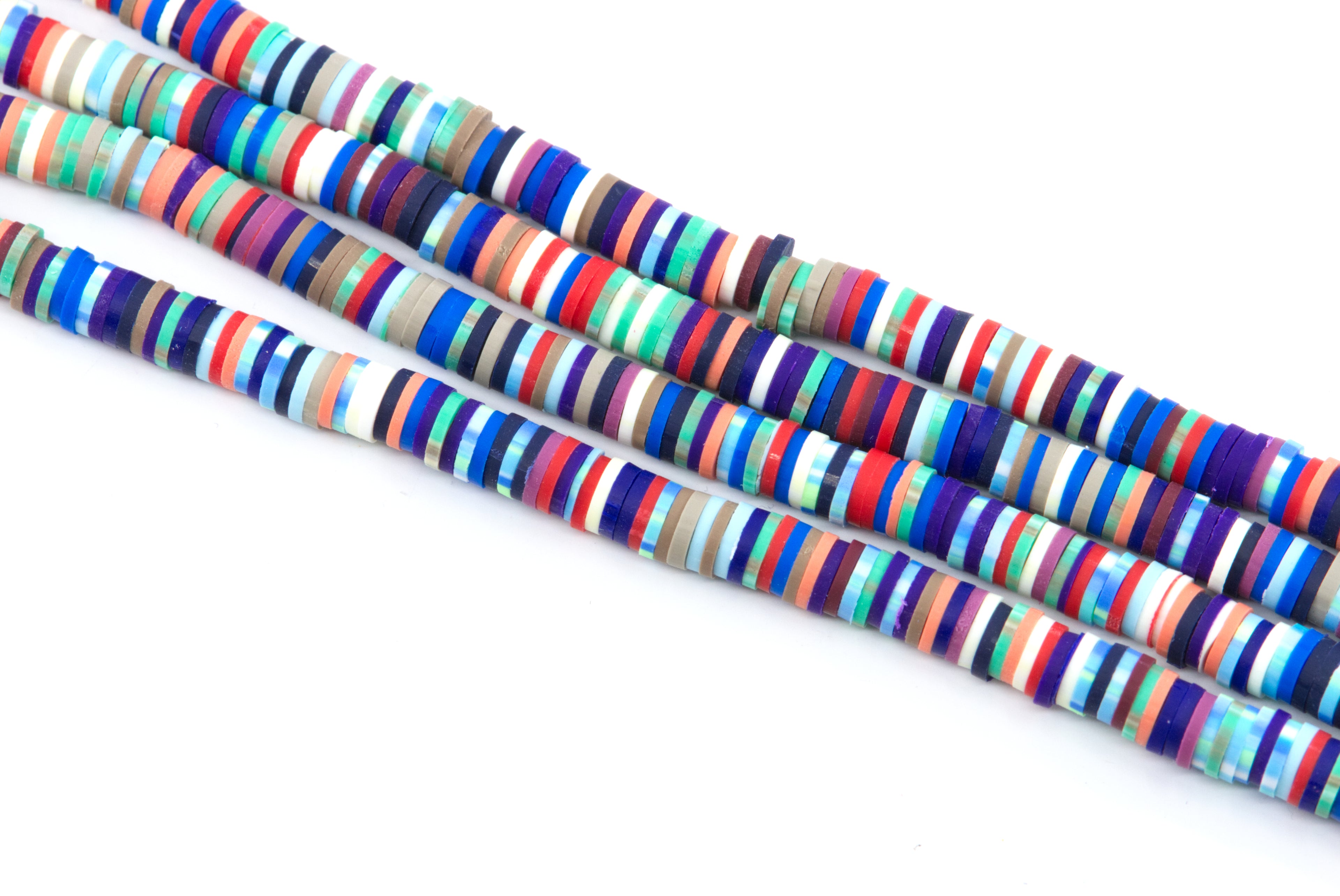 Several strands of red and blue multi-color polymer clay disc beads arranged diagonally on a plain white background.