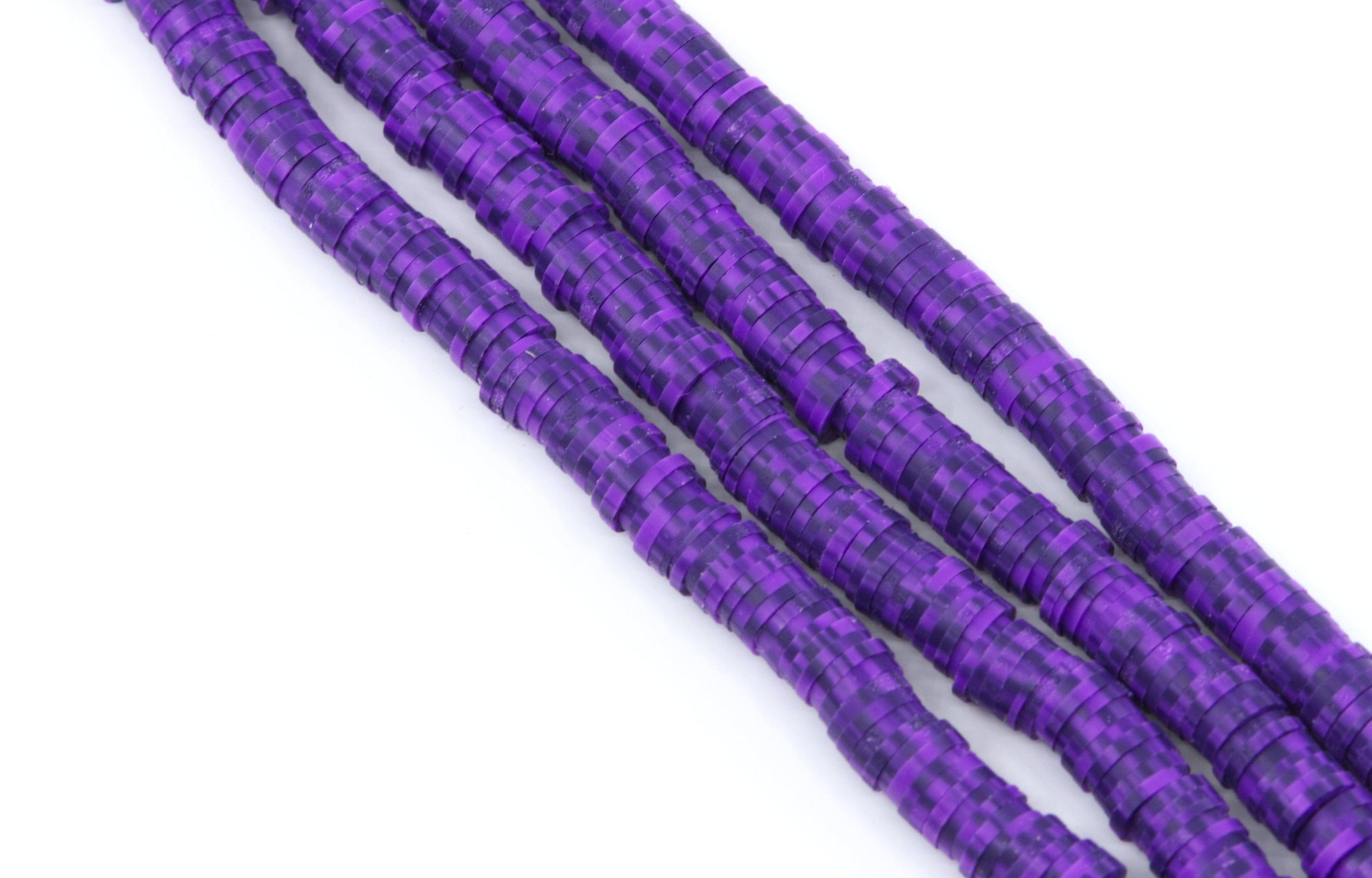 four strands of dark speckled purple polymer clay disc beads on a white background.