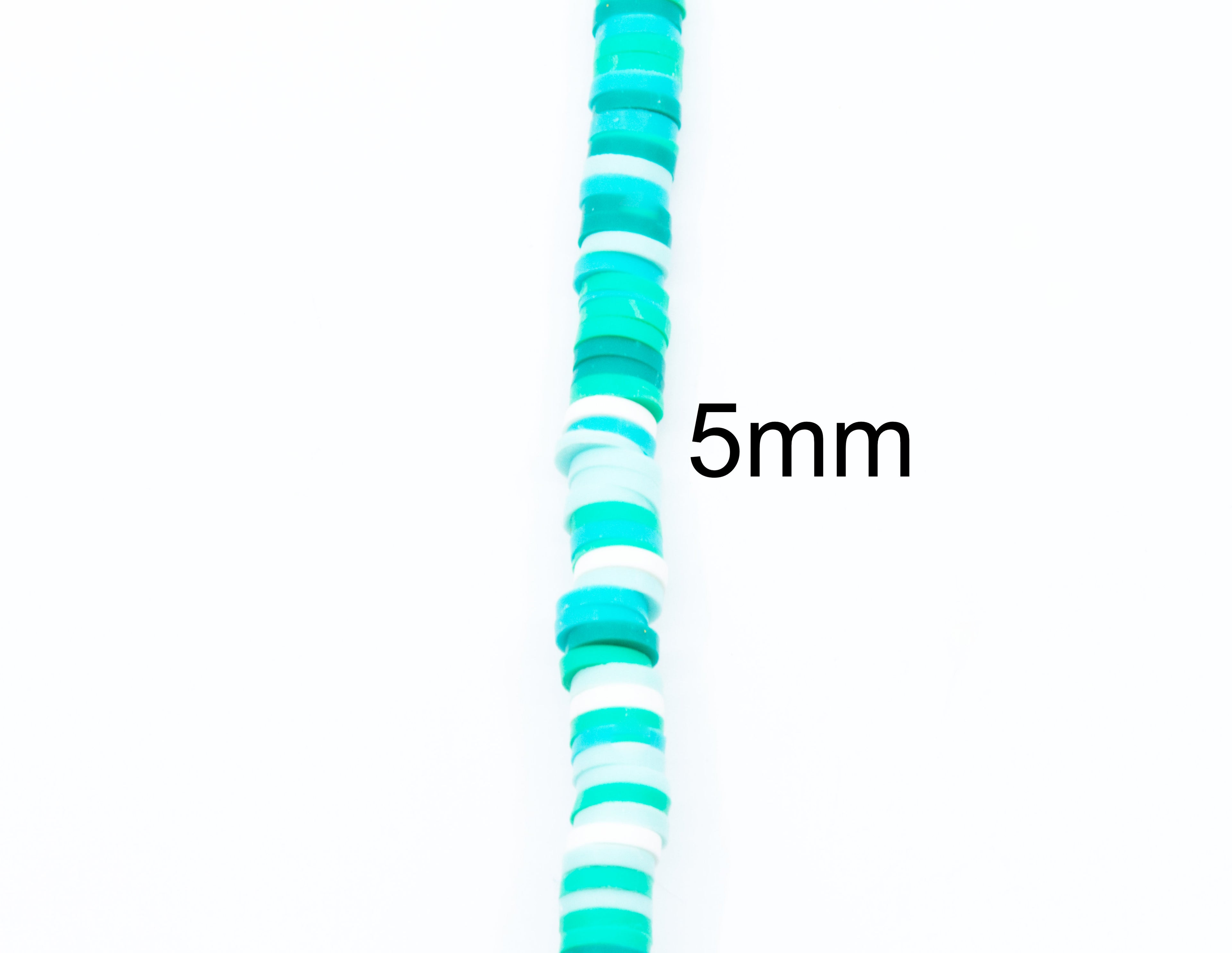 A vertical strand of blue and green polymer clay disc beds , with the text '5mm' overlaid on the right side to indicate size against a plain white background.