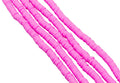 multiple strands of pink polymer clay disc beads arranged diagonally on a plain white background.