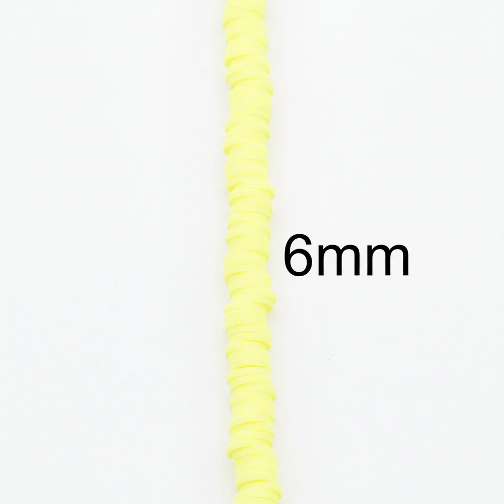 A close-up of a bright yellow polymer clay disc beads vertically on a plain gray background, with the text '6mm' overlaid to indicate its diameter.