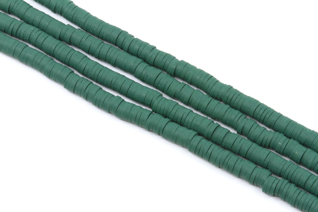 Four strands of dark green polymer clay disc beads arranged diagonally on a plain white background.