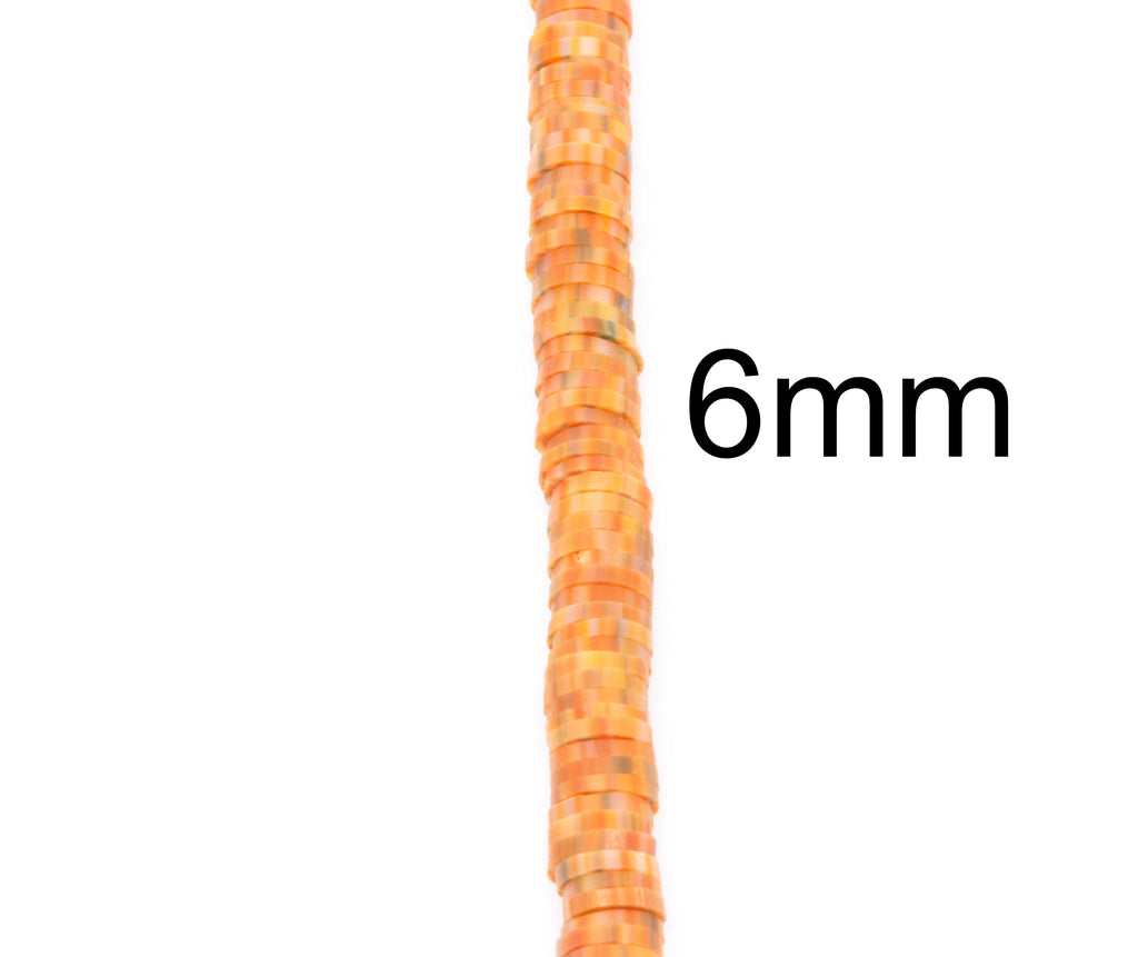 String of orange beads with a 6mm measurement label on a white background
