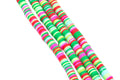 Four strands of colorful green and pink polymer clay disc beads arranged diagonally on a plain white background.