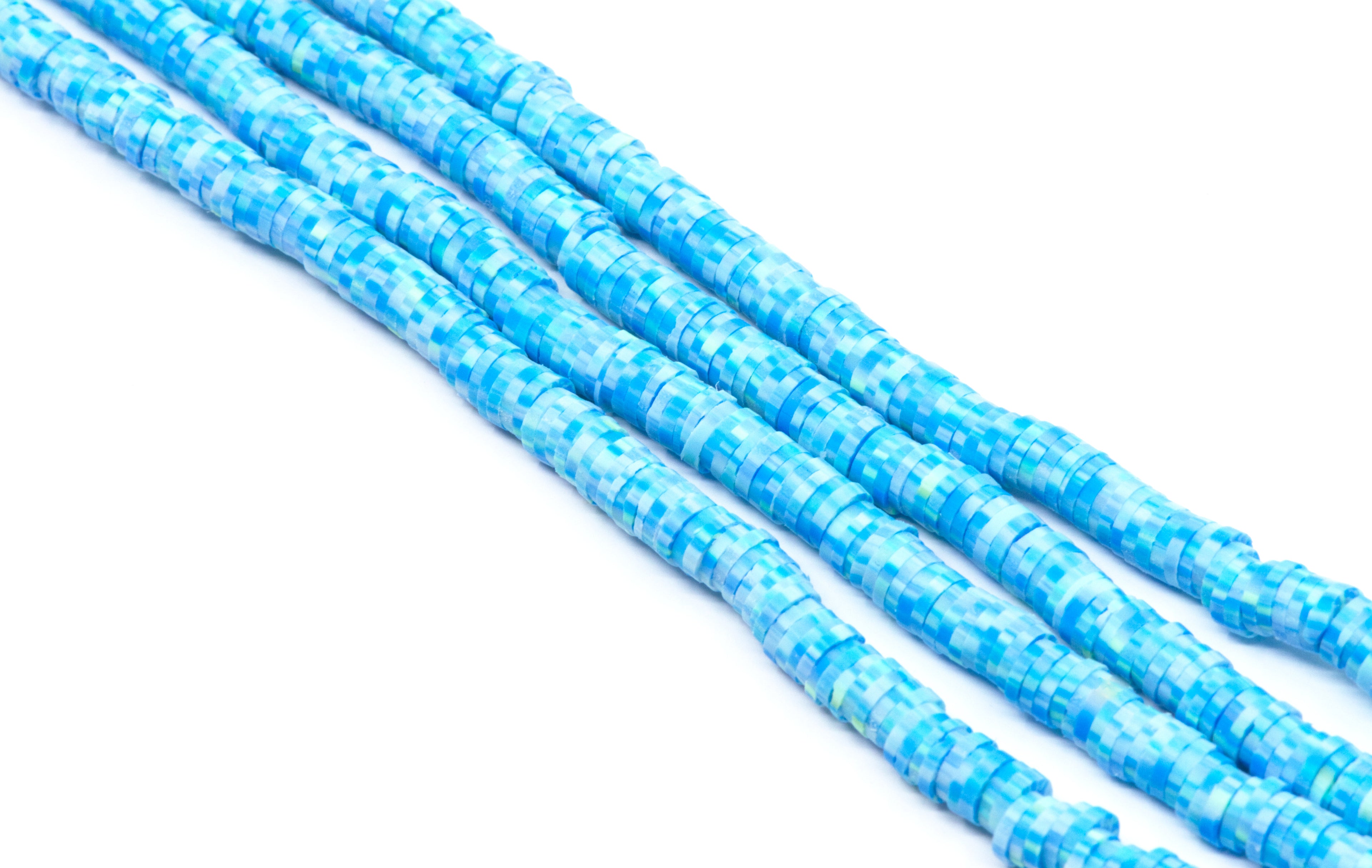Four strands of blue polymer clay disc beads shown diagonally and  photographed on a clean white background.