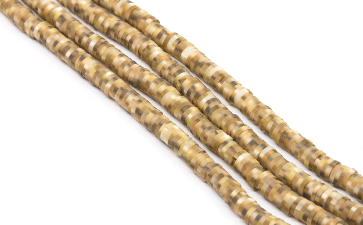 Multiples strands of polymer clay beads a brown pattern in shades of tan, beige, and brown, photographed on a clean white background.
