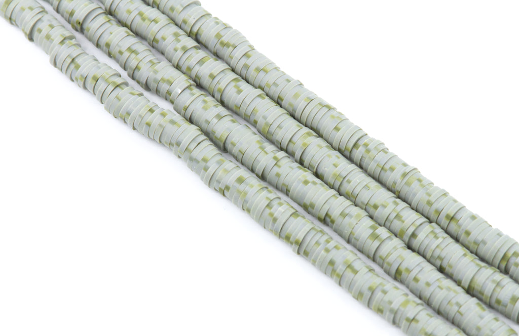 four strands of gray and green speckled polymer clay disc beads arranged diagonally on a white background.
