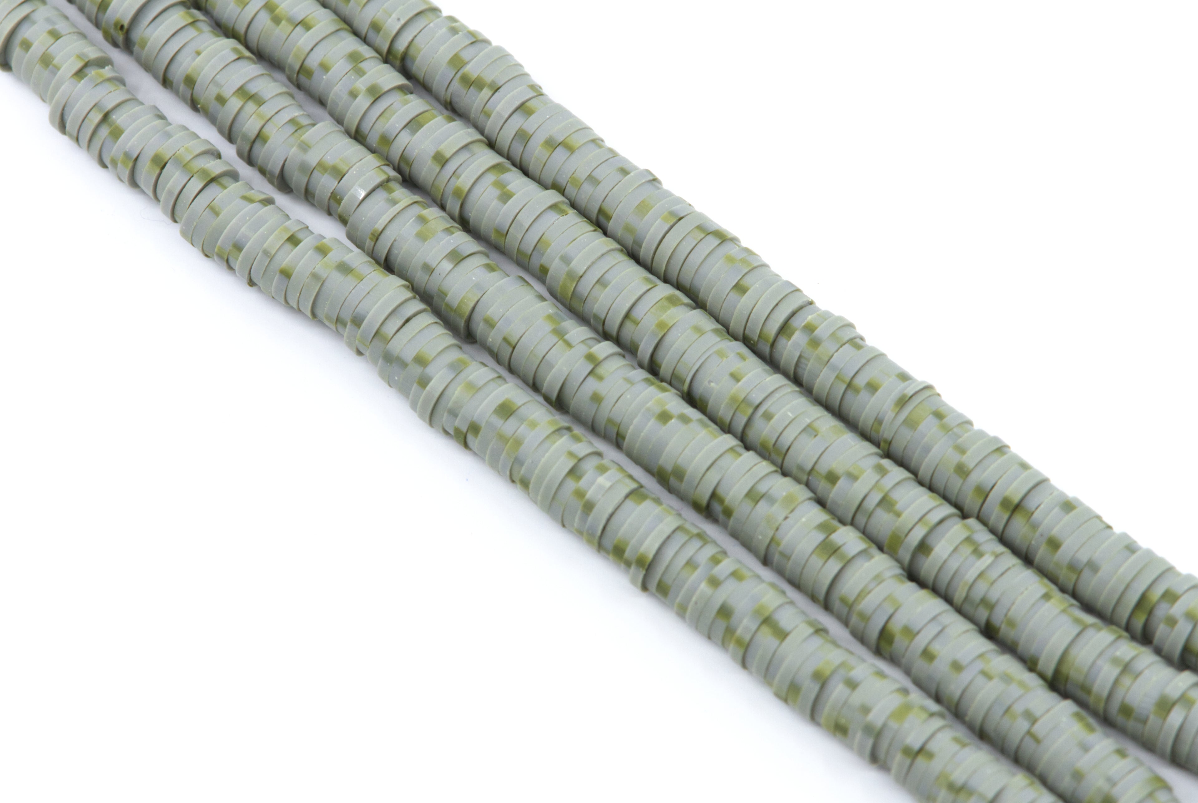 four strands of gray and green speckled polymer clay disc beads arranged diagonally on a white background.