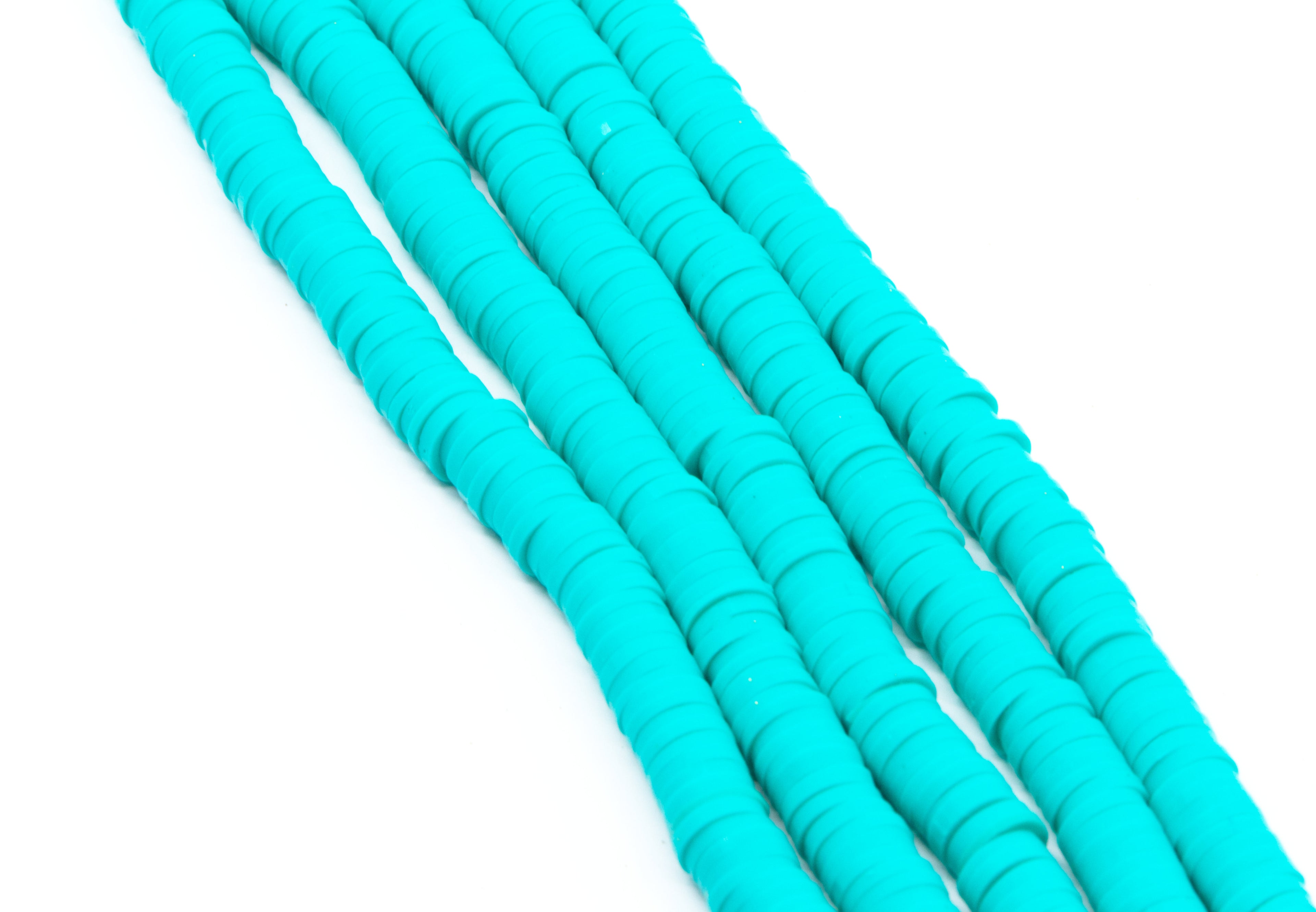 aqua blue polymer clay disc bead strands arranged diagonally on a plain white background.