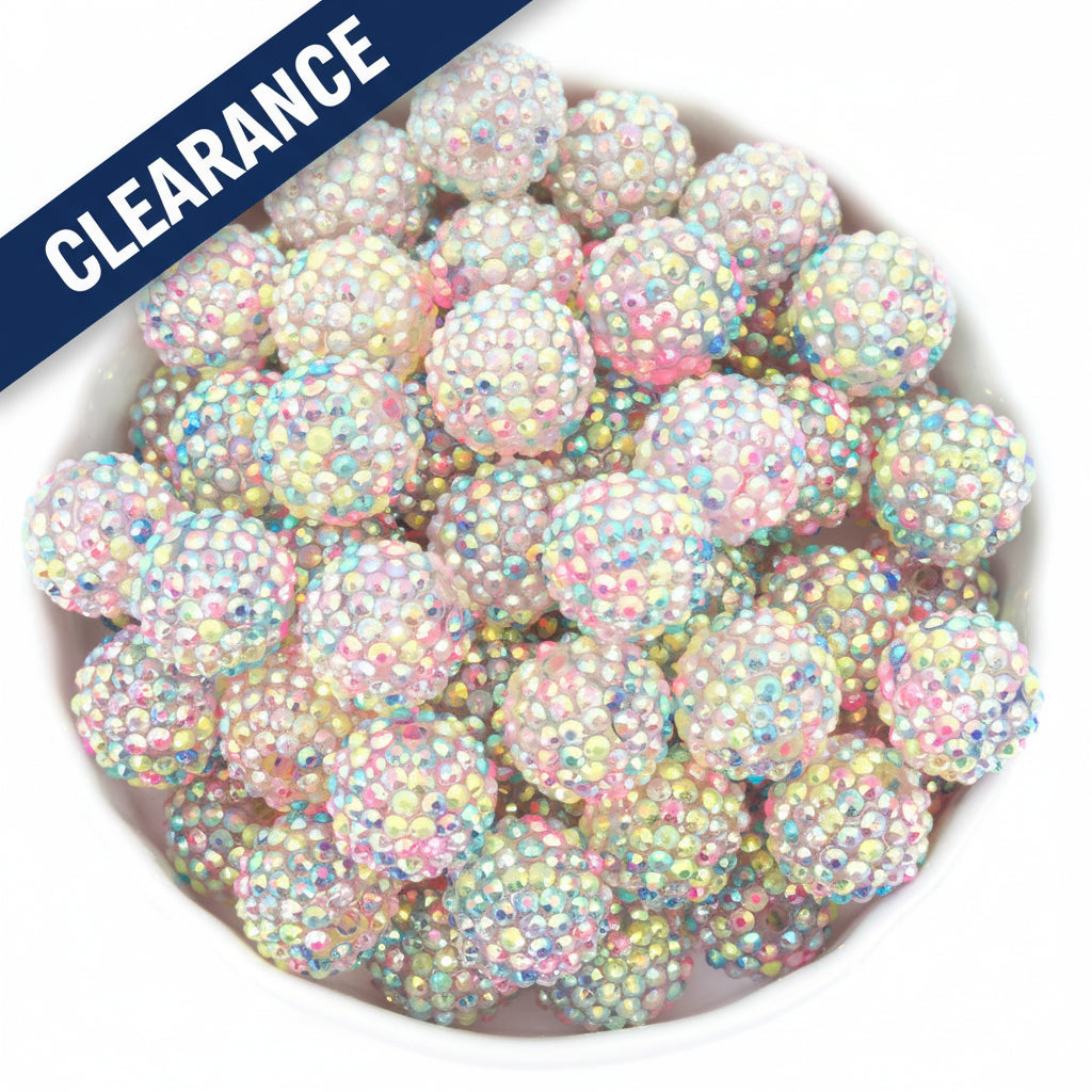 pastel rainbow rhinestone beads on a white background