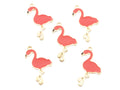 Five coral flamingo-shaped jewelry charms with gold-tone metal outlines and loops, arranged on a plain white background.