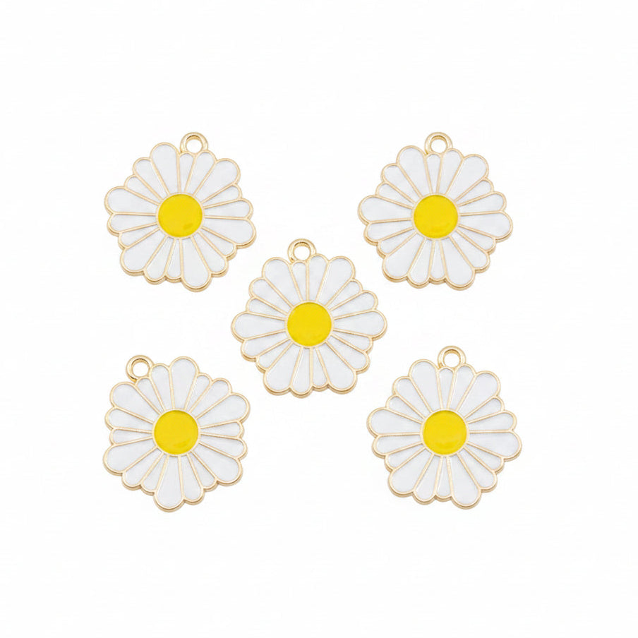 Five white daisy flower charms with yellow centers and gold-tone metal edges, arranged on a white background.