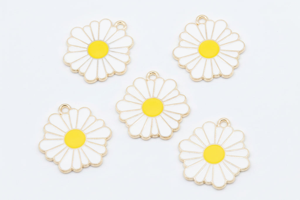 Five white daisy flower charms with yellow centers and gold-tone metal edges, arranged on a white background.