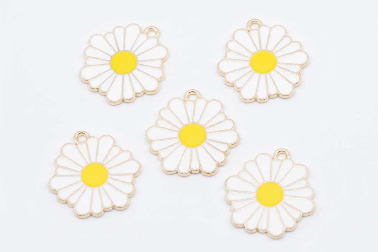 Five white daisy flower charms with yellow centers and gold-tone metal edges, arranged on a white background.