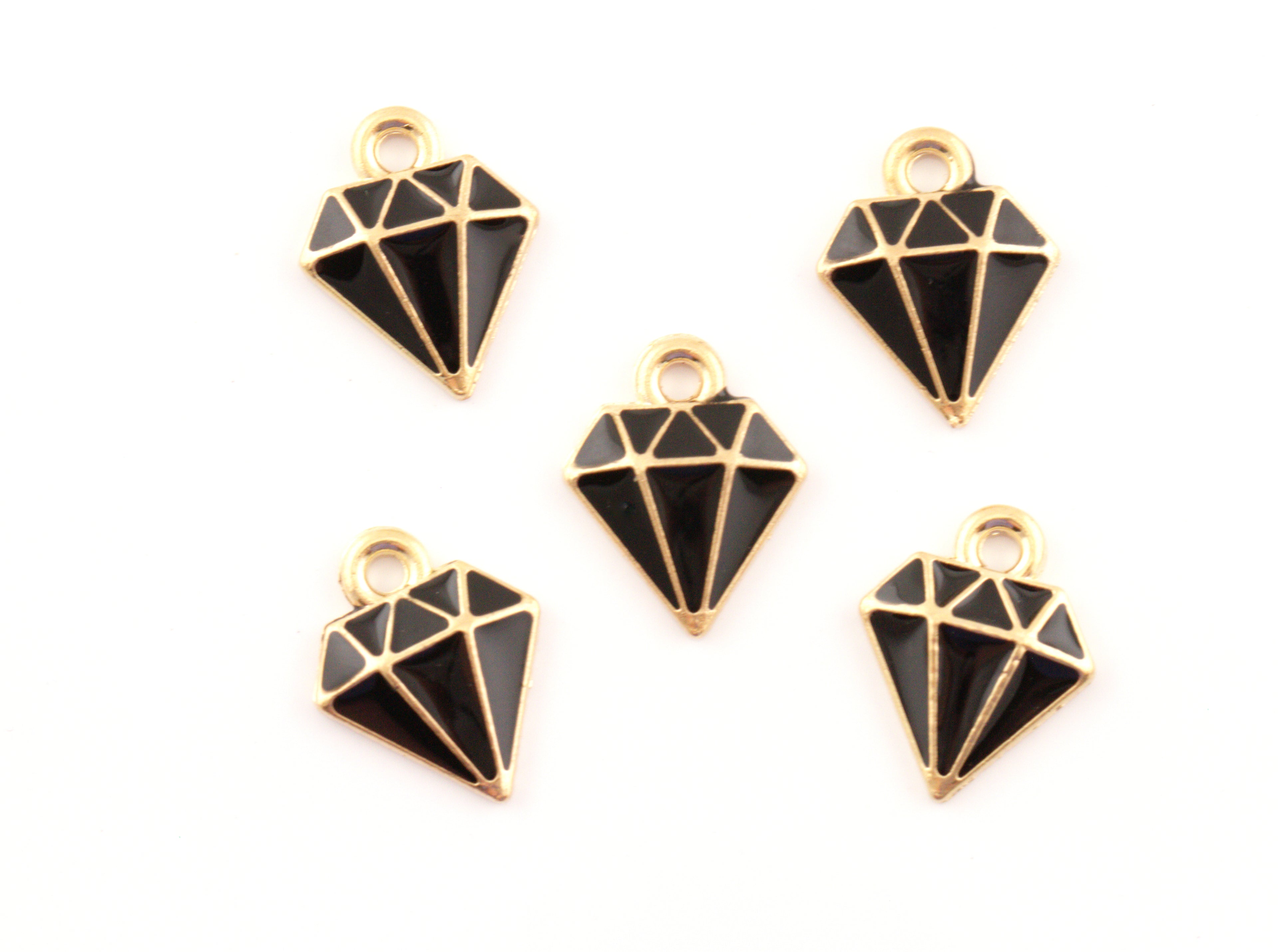 Five black and gold diamond-shaped jewelry charms with cutout facets, arranged on a plain white background.