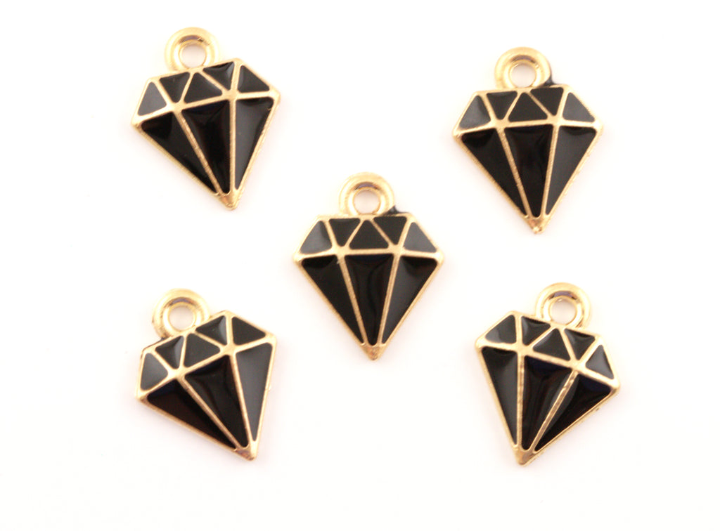 Five black and gold diamond-shaped jewelry charms with cutout facets, arranged on a plain white background.
