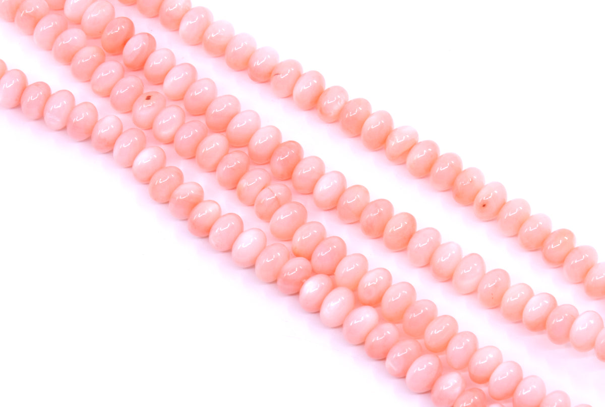 Four strands of shell abacus beads in a coral color on a clean white background.