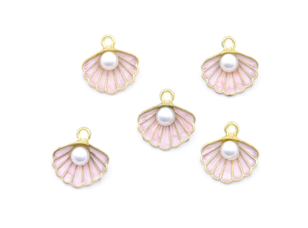 Five gold-plated shell-shaped charms with pale pink enamel inlay and a white faux pearl in the center, arranged on a plain white background.