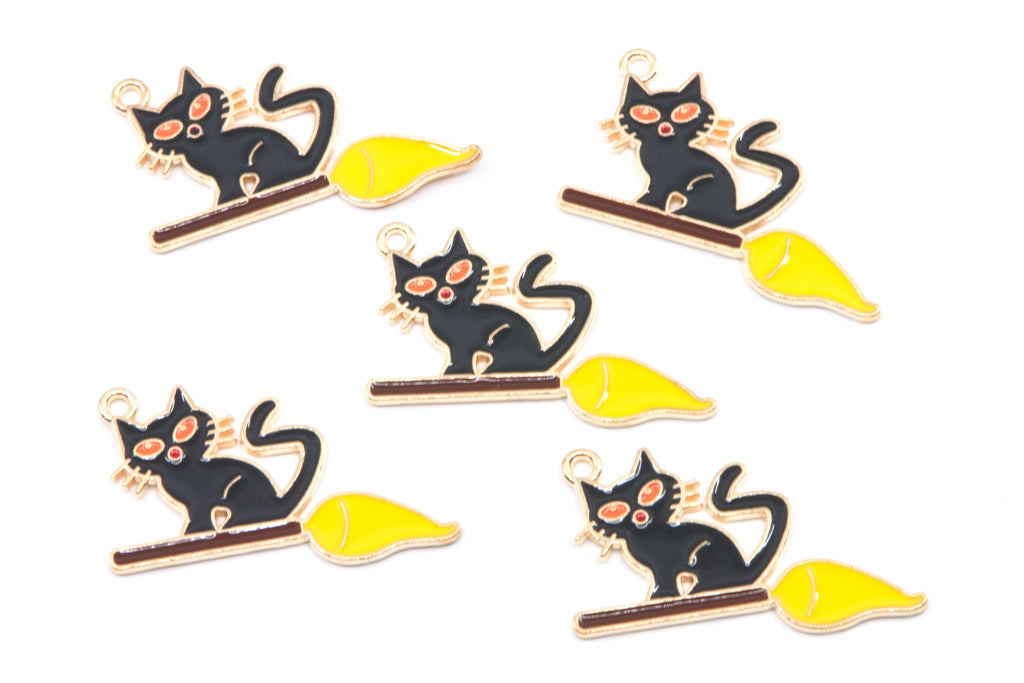 Five identical enamel charms of a black cat sitting on a yellow broomstick, arranged on a plain white background.