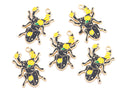 Five black beetle charms with gold-tone metal outlines, decorated with yellow roses and green leaves, arranged on a plain white background.