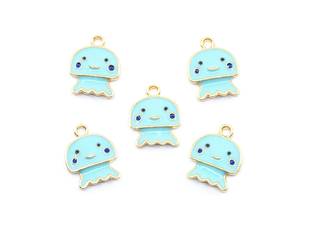 Five light blue jellyfish charms with gold-tone metal borders, small blue gemstone eyes, and black facial features, arranged on a plain white background.