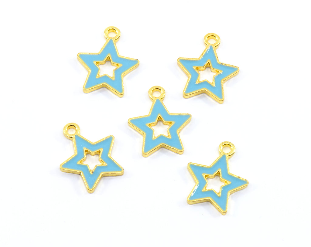 Five star-shaped jewelry charms with light blue enamel and gold metal trim, arranged on a plain white background.