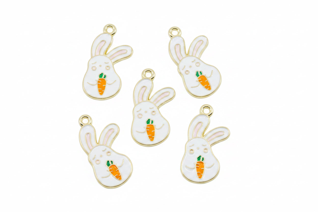 Five white bunny charms with gold-tone edges, holding small orange carrots with green tops, arranged on a white background.
