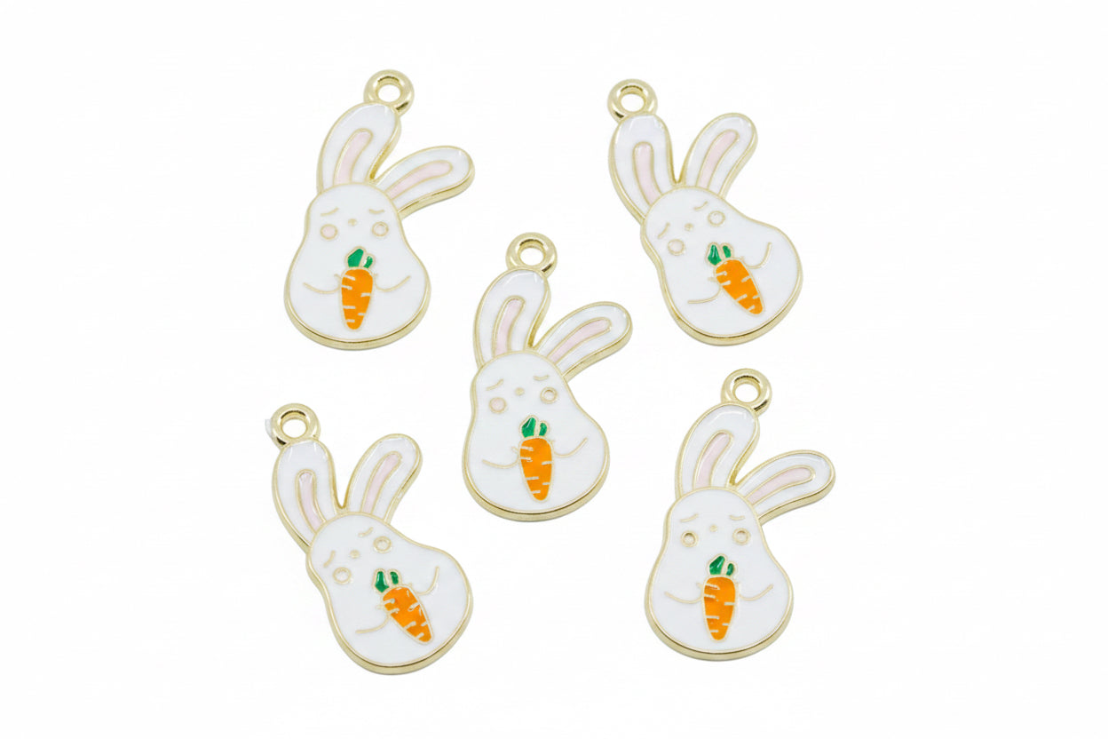 Five white bunny charms with gold-tone edges, holding small orange carrots with green tops, arranged on a white background.