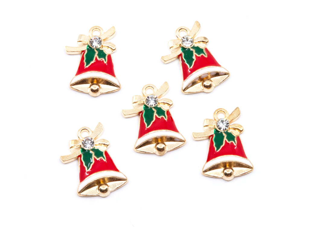 Five Christmas bell charms with red enamel, gold-tone metal borders, green holly leaves, and a clear rhinestone, arranged on a white background.
