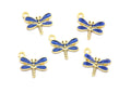 Five dragonfly charms with blue enamel wings and gold-tone metal bodies, arranged on a plain white background.