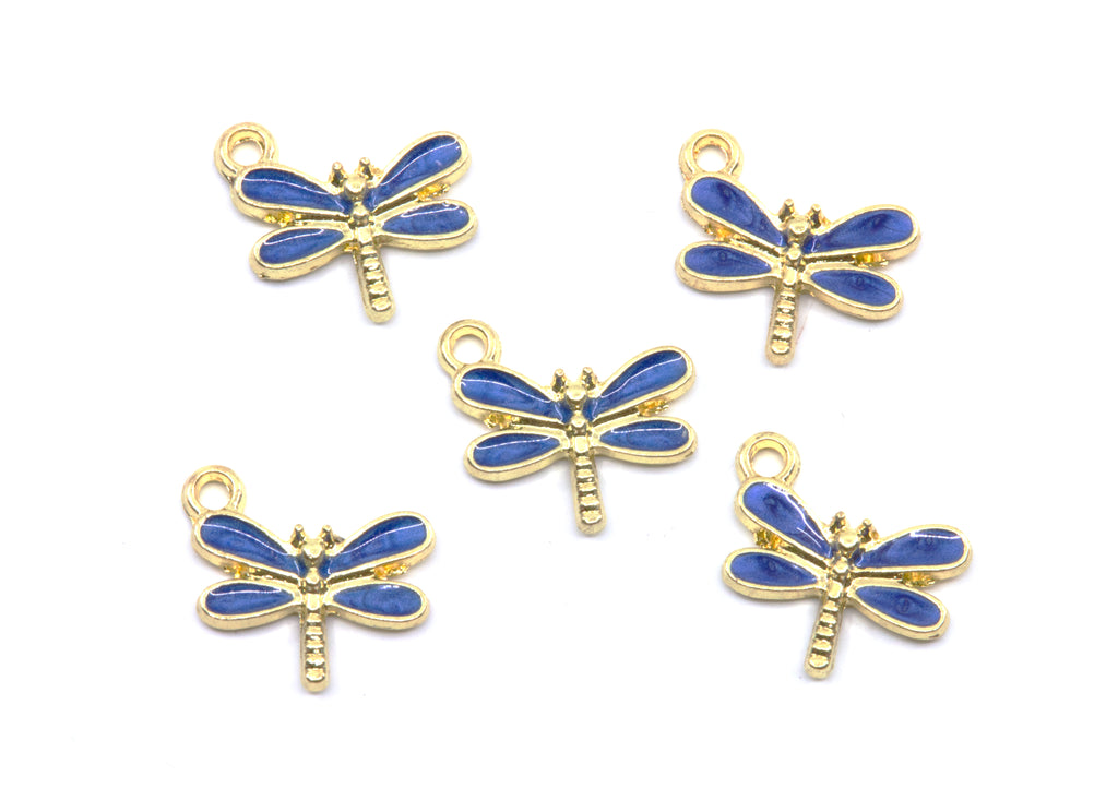 Five dragonfly charms with blue enamel wings and gold-tone metal bodies, arranged on a plain white background.