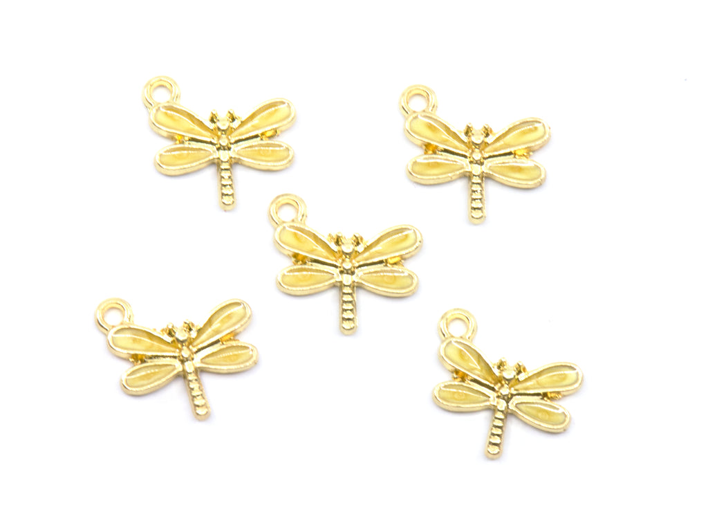 Five yellow dragonfly charms with small hanging loops, arranged on a plain white background.