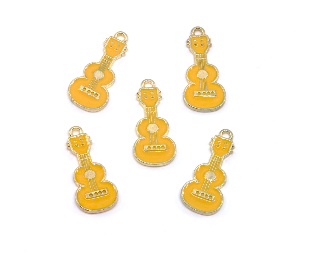 Five small guitar-shaped jewelry charms in  yellow enamel with gold-tone metal edges and loops, arranged on a plain white background.