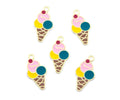 Five enamel ice cream cone charms with gold-tone metal outlines, featuring pink, yellow, and teal scoops with a small red cherry on top, arranged on a plain white background.