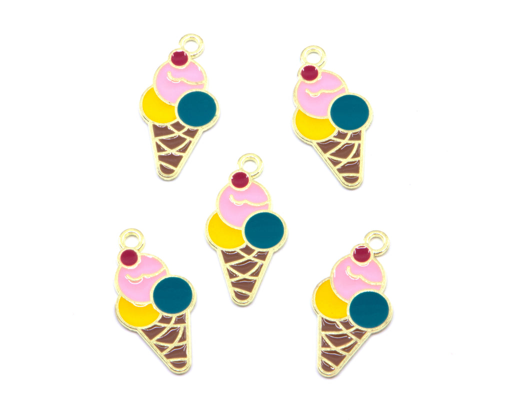 Five ice cream cone charms with gold-tone metal outlines, featuring pink, yellow, and teal enamel scoops, brown waffle cone details, and small red cherry accents on a plain white background.