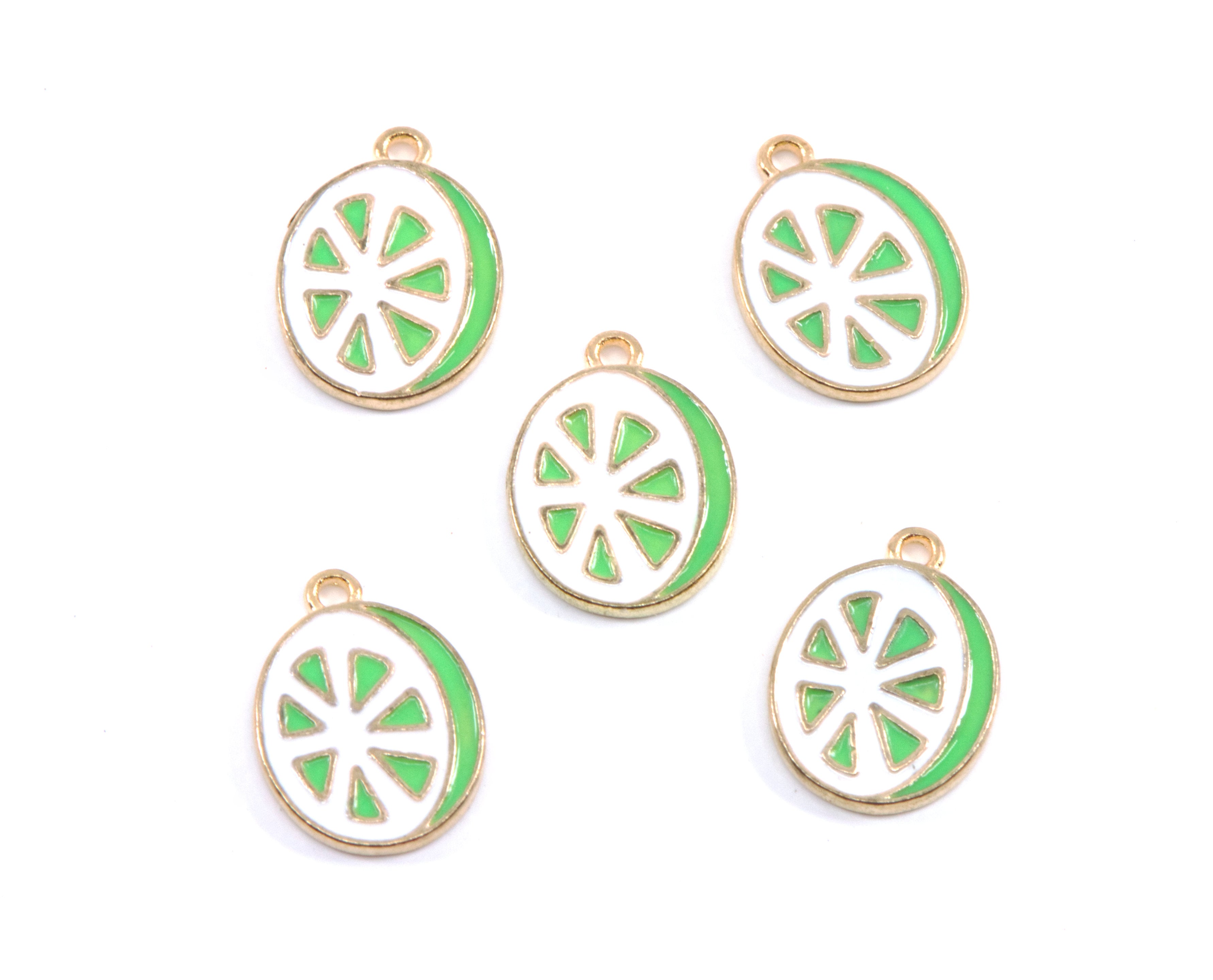 Five enamel charms shaped like lime slices, featuring a gold-tone metal border, white center, and bright green outer ring, arranged on a plain white background.