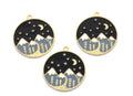 Three round gold-tone charms featuring a night sky and mountain landscape design, displayed on a clean white background.