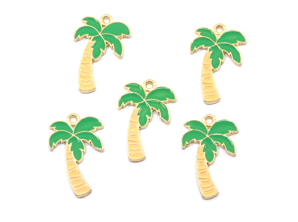 Five small palm tree charms with green enamel leaves and light brown trunks, arranged on a plain white background.
