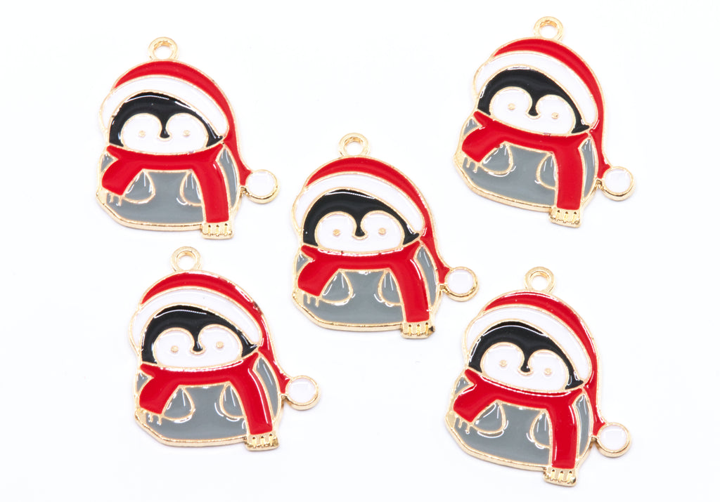Five identical penguin charms wearing Santa hats and scarves, arranged on a plain white background. Each charm has a gold-tone outline with red, white, black, and gray enamel details and a small loop at the top.