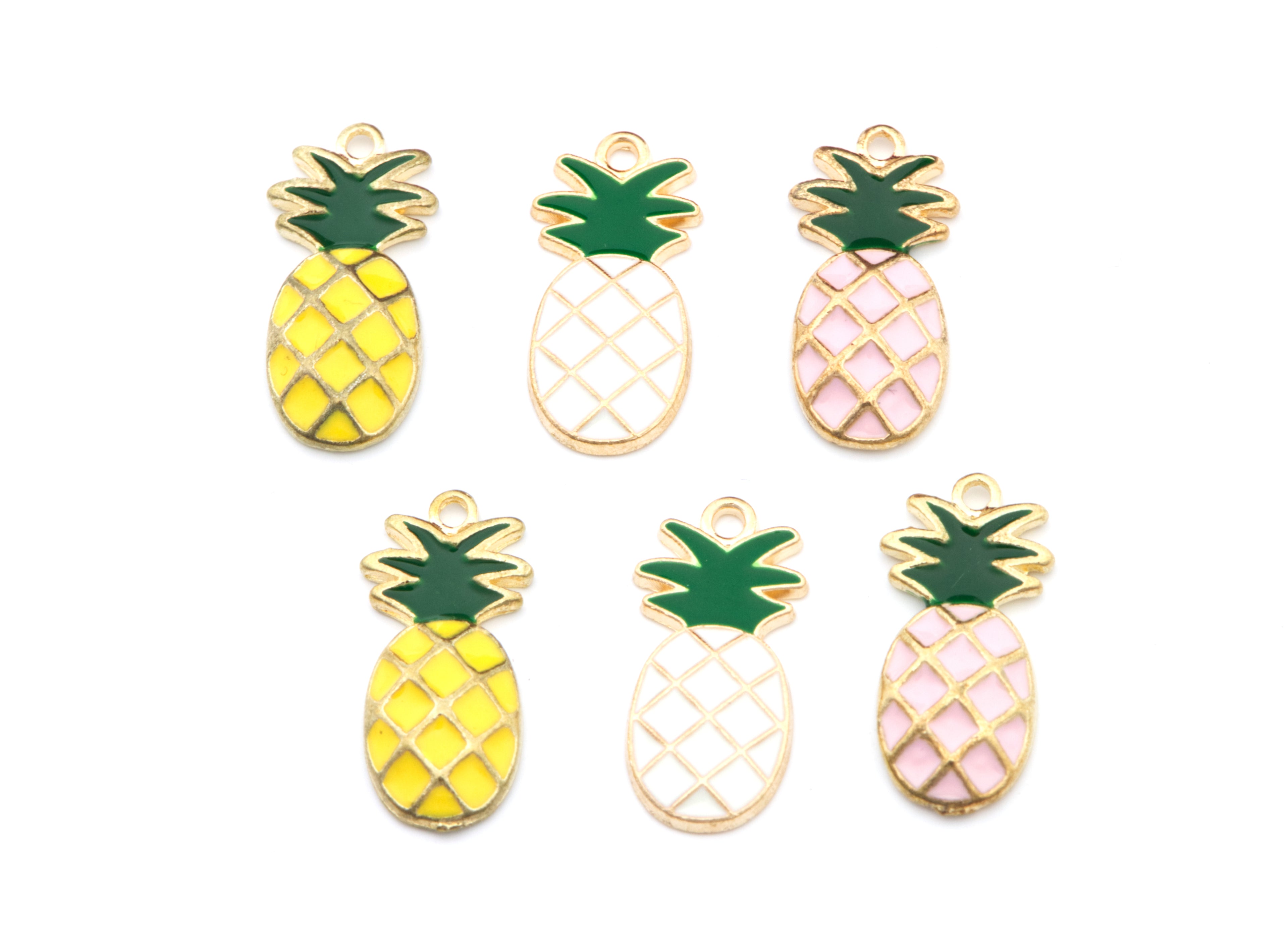 Six pineapple-shaped enamel charms with gold-tone metal outlines, arranged on a plain white background. The charms feature yellow, white, and light pink fillings with green tops.