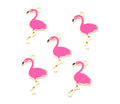 Five pink flamingo charms with gold-tone metal borders and loops, arranged on a plain white background.