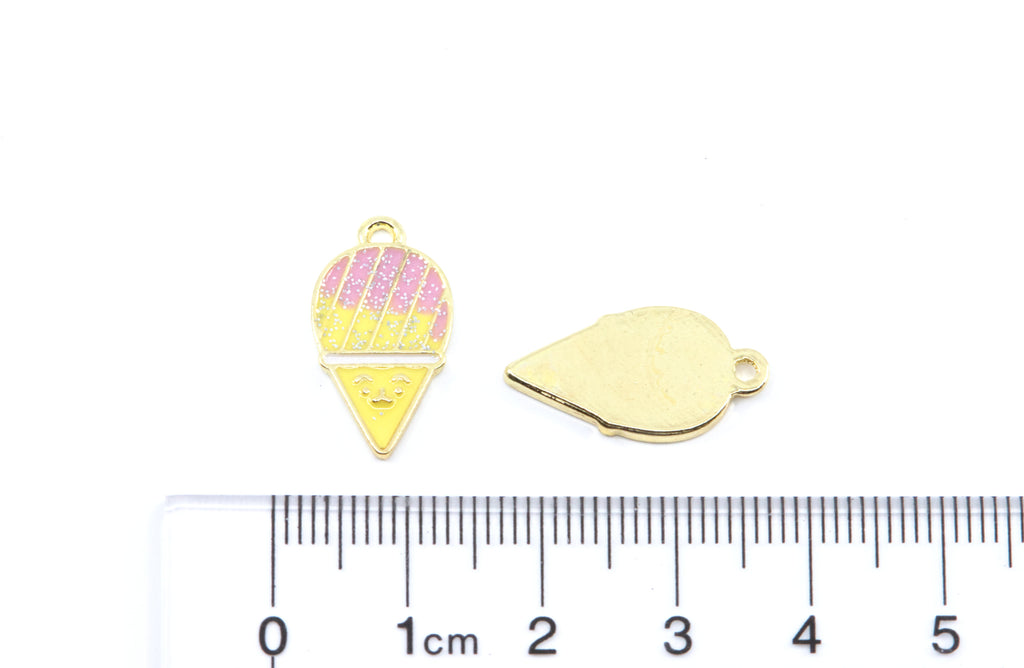 Two pink and yellow snow cone charms on a white background with a cm ruler below for scale