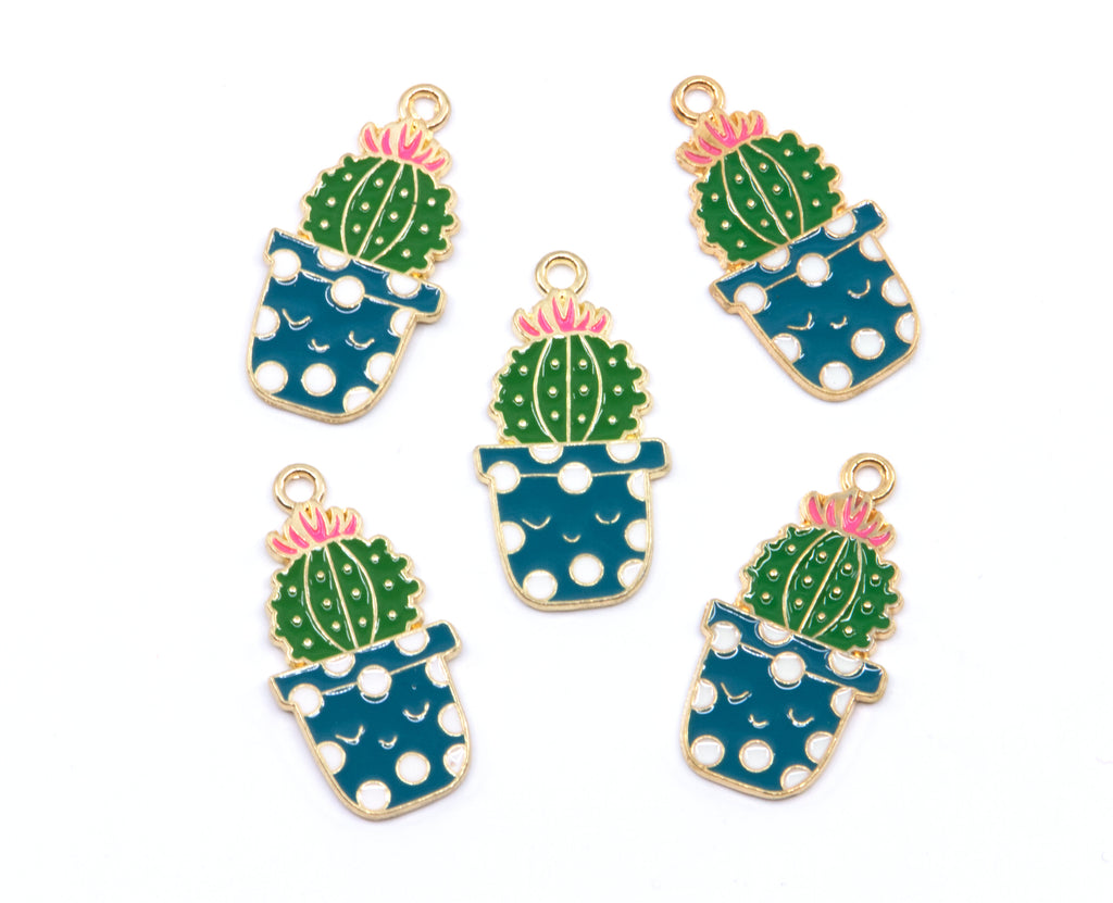 Five enamel jewelry charms shaped like potted cacti, arranged on a plain white background. Each charm features a green cactus with a pink flower, set in a blue pot with white polka dots and outlined in gold-tone metal.