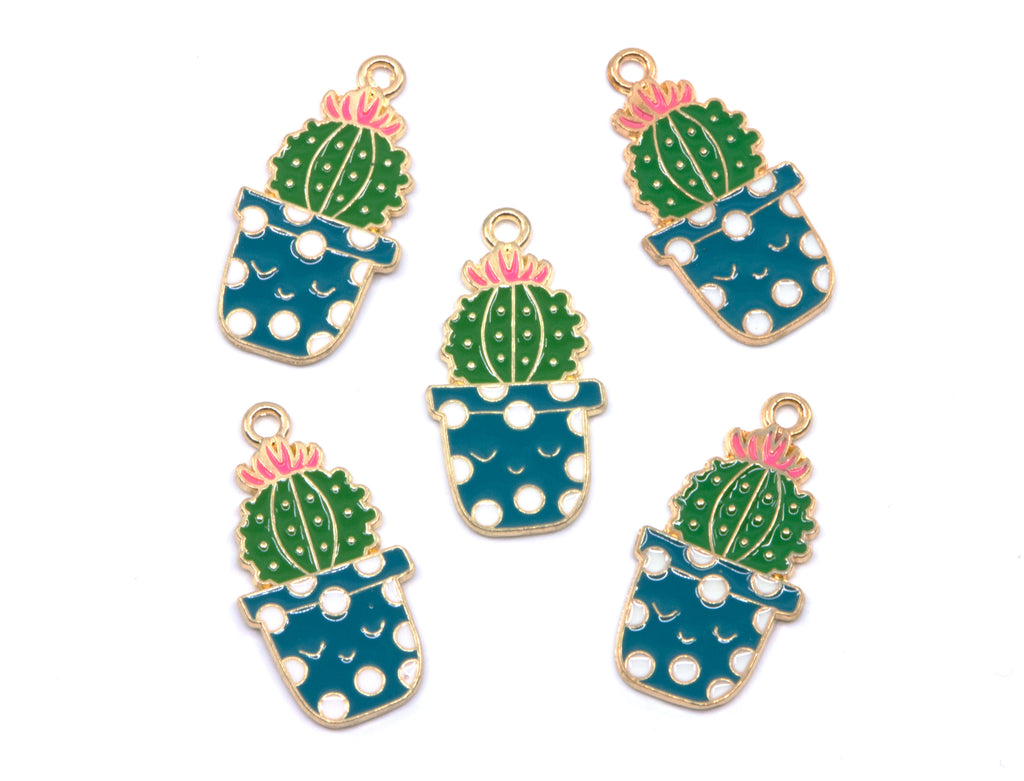 Five enamel jewelry charms shaped like potted cacti, arranged on a plain white background. Each charm features a green cactus with a pink flower, set in a blue pot with white polka dots and outlined in gold-tone metal.