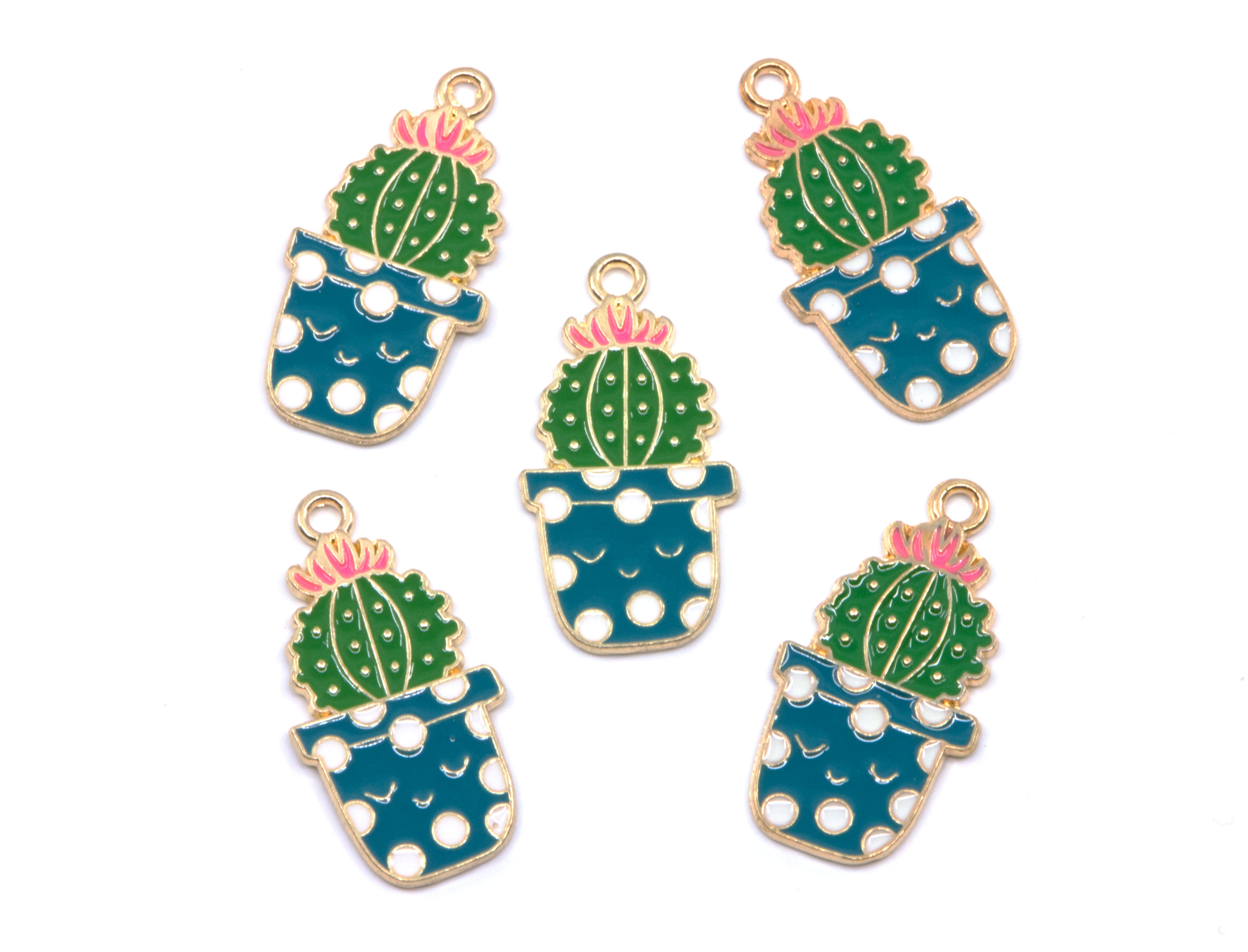 Five enamel jewelry charms shaped like potted cacti, arranged on a plain white background. Each charm features a green cactus with a pink flower, set in a blue pot with white polka dots and outlined in gold-tone metal.